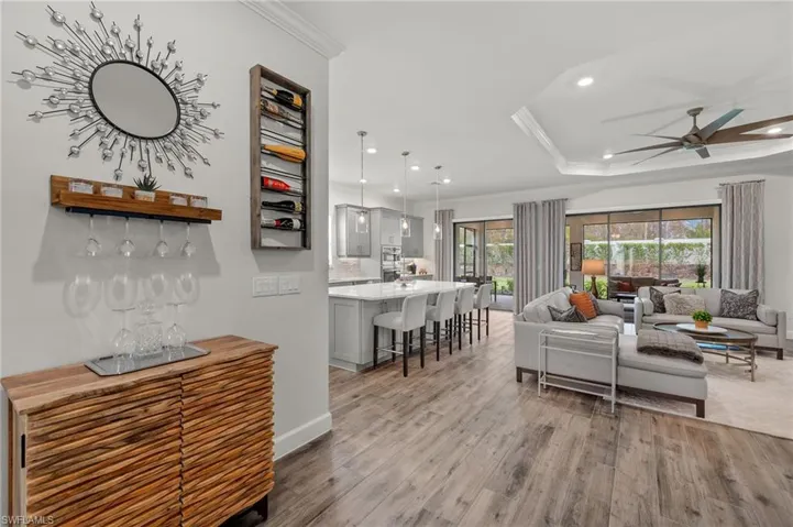Living room. raised ceiling, tray ceiling, ceiling fan,  and crown ornamental molding