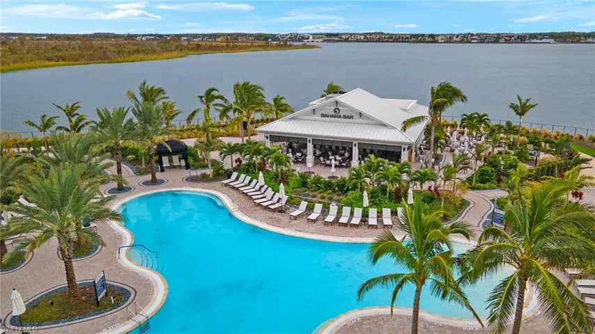 View of resort swimming pool, Bahama Bar and Lake Cuomo