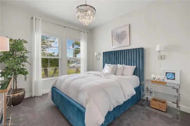 Bedroom #2,  featuring chandelier lighting & wall sconces