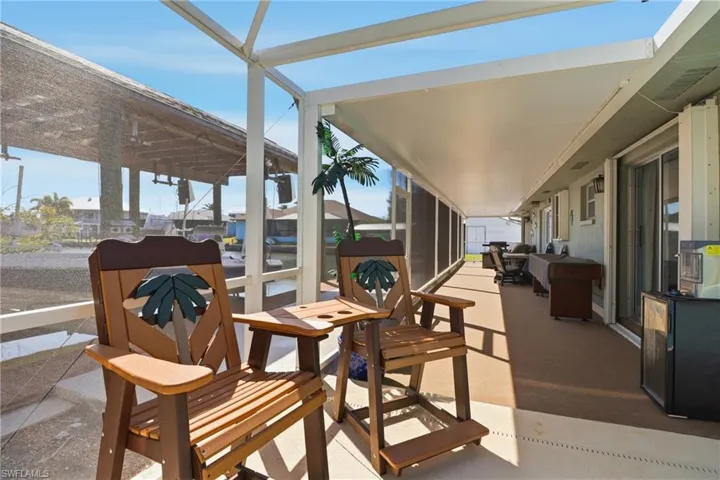 View of patio / terrace featuring a sunroom
