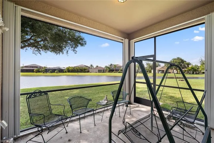 Unfurnished sunroom featuring a water view