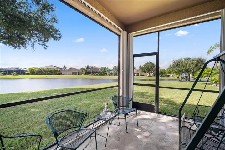 Unfurnished sunroom featuring a water view