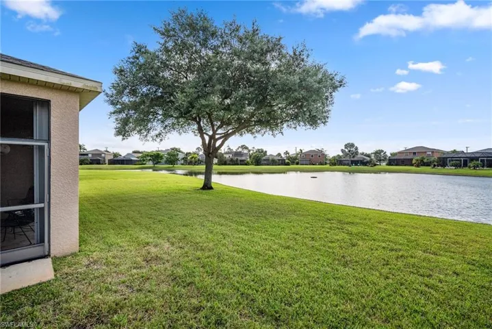 View of yard with a water view