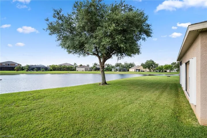 View of yard with a water view