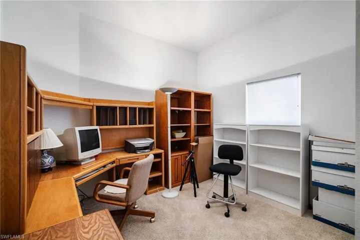 Office space featuring light carpet