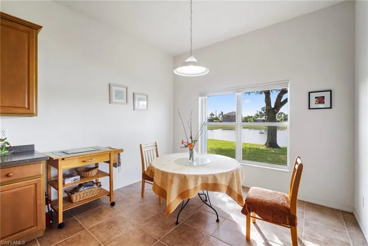 Tiled dining space with a water view