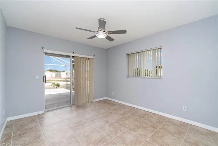 Bedroom overlooking pool deck and canal.