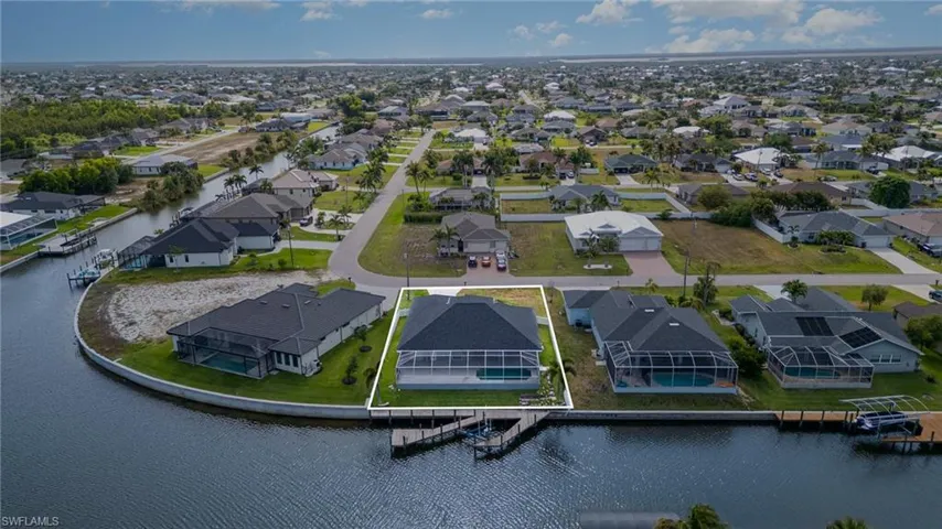 Aerial view of residential area, canal, lot lines,