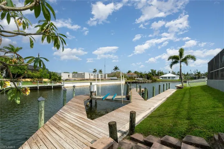 Double Dock, boat lift, steps leading down.