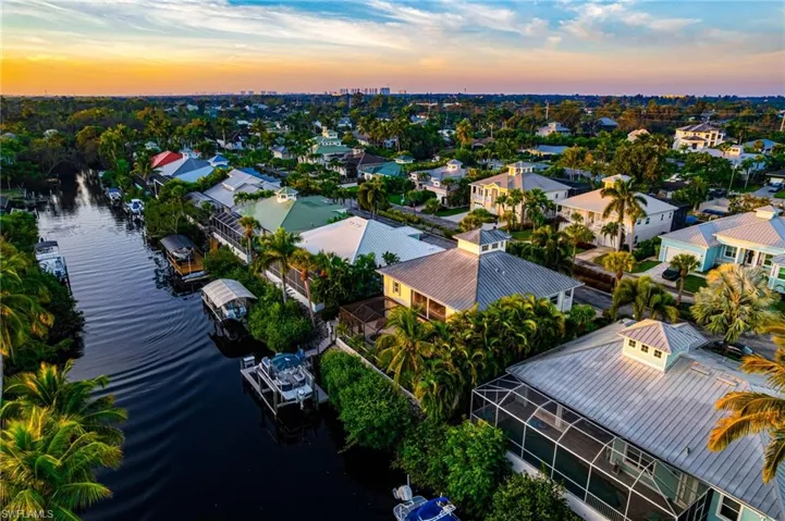 Ideal wider side of intercoastal river waterway. 80 foot wide. 6 to 8 feet .  Aerial view at dusk of a water view and a residential view