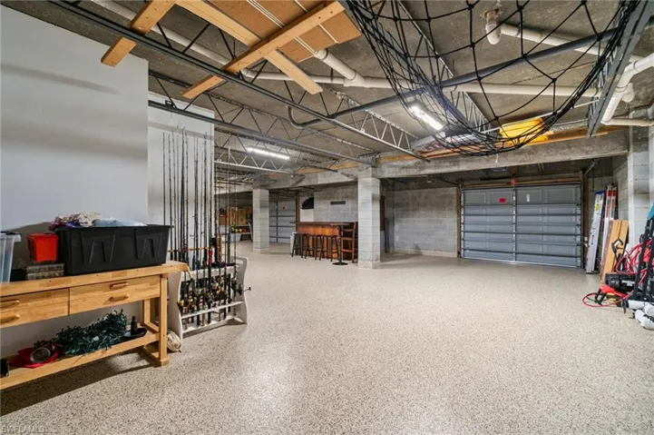 All concrete, black walls, and ceiling and floor with spillway functionality.
