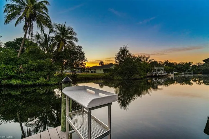 80 foot wide intercoastal river waterway is approximately 6 to 8 feet deep. This is the corner of the dock view at sunrise off the durable composite deck area with an expansive water view.
