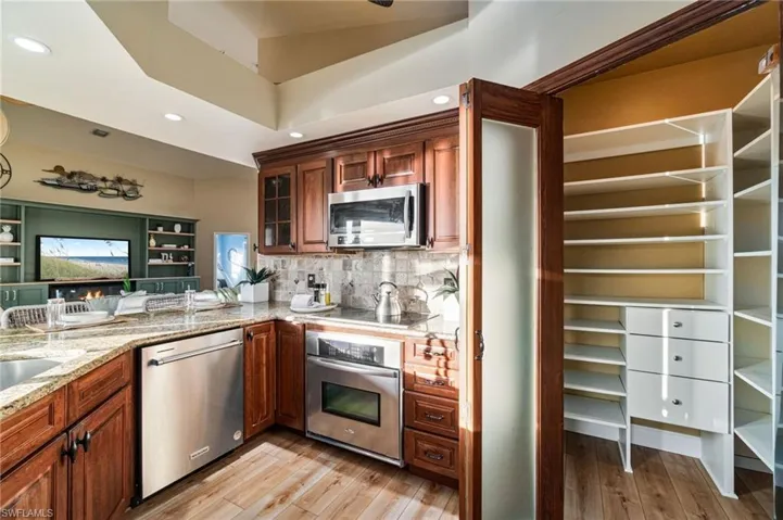 Kitchen offers custom pantry  for storage