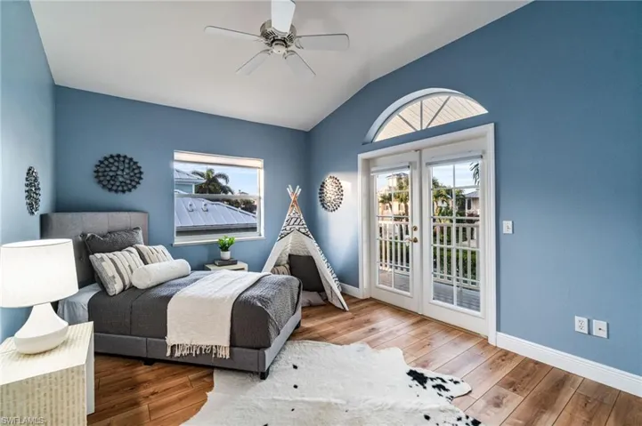 Bright guest bedroom with balcony access and plenty of natural light