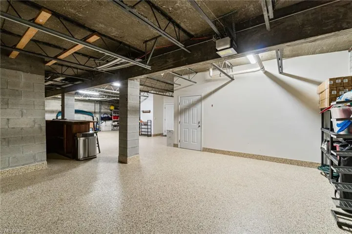 View of extra deep for car tandem garage. Concrete block, first floor with concrete ceiling.