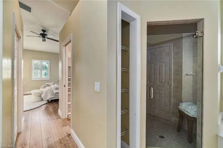 Hall featuring baseboards and light wood-style floors