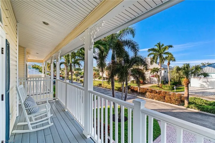 Charming front porch ideal for morning coffee and neighborhood views.  All weather decking for low maintenance.