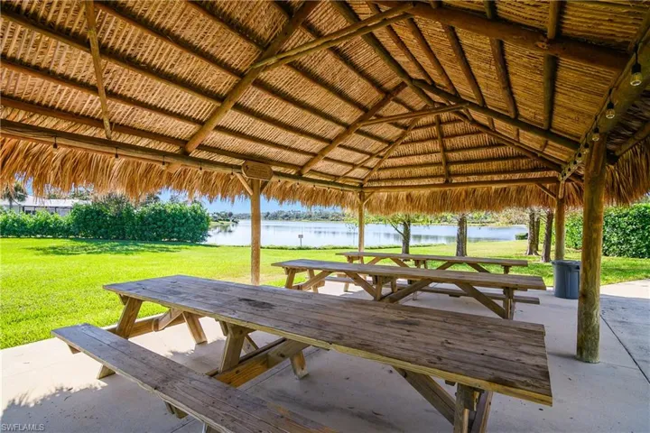 Surrounding community featuring a gazebo, a yard, and a water view