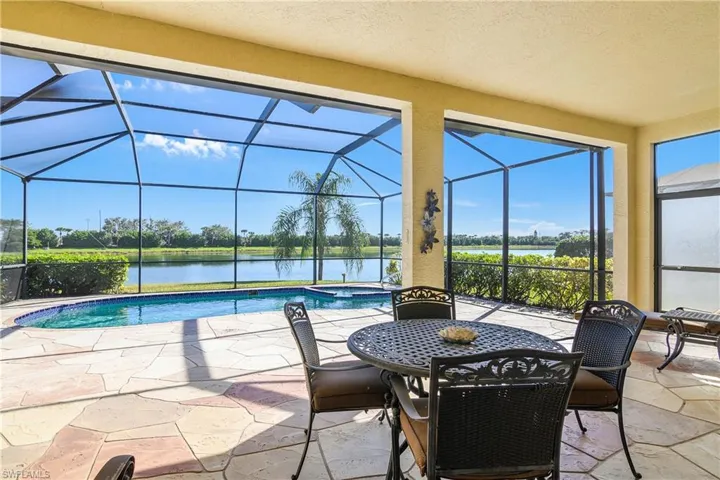 View of pool with a water view