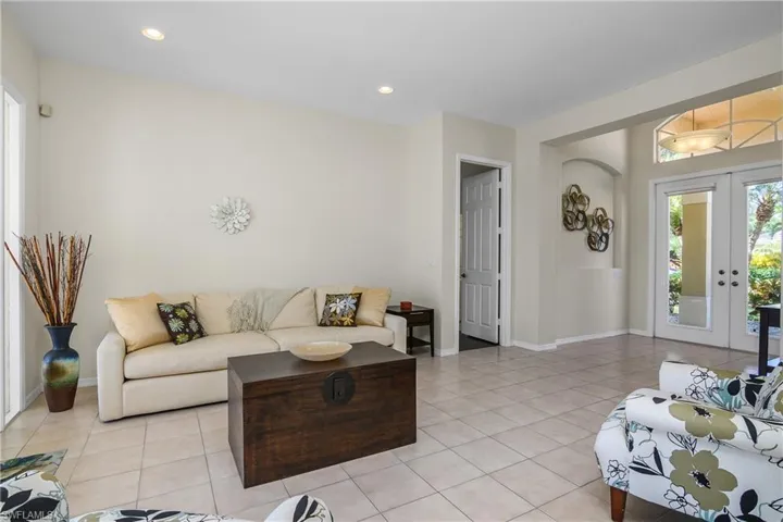 Living room featuring french doors and light tile patterned floors