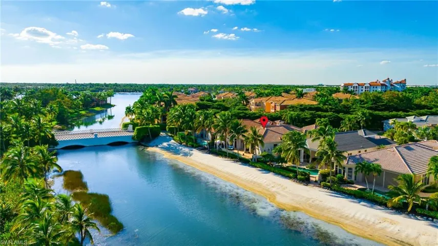 Drone / aerial view of a large body of water and a notable bridge