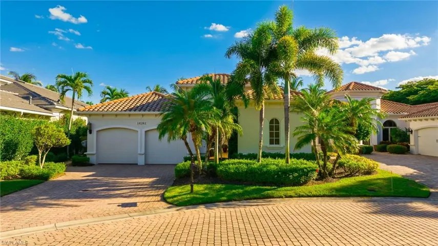 Mediterranean / spanish-style home featuring stucco siding, a tile roof, decorative driveway, and a garage