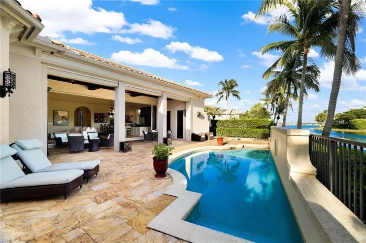 View of pool featuring an outdoor hangout area, a patio area, and a water view