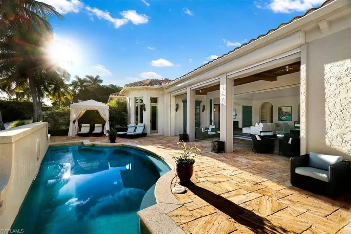 Outdoor pool with an outdoor living space, a gazebo, and a patio