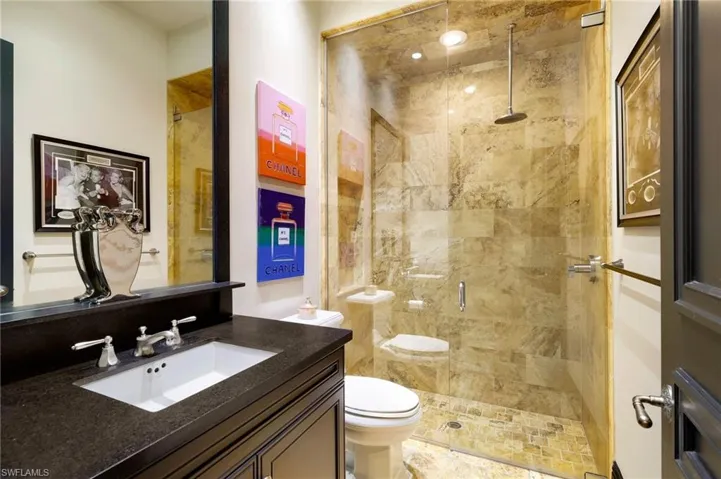 Full bathroom featuring vanity and a stall shower