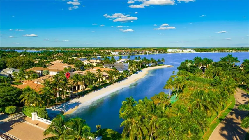 Aerial perspective of suburban area with a nearby body of water