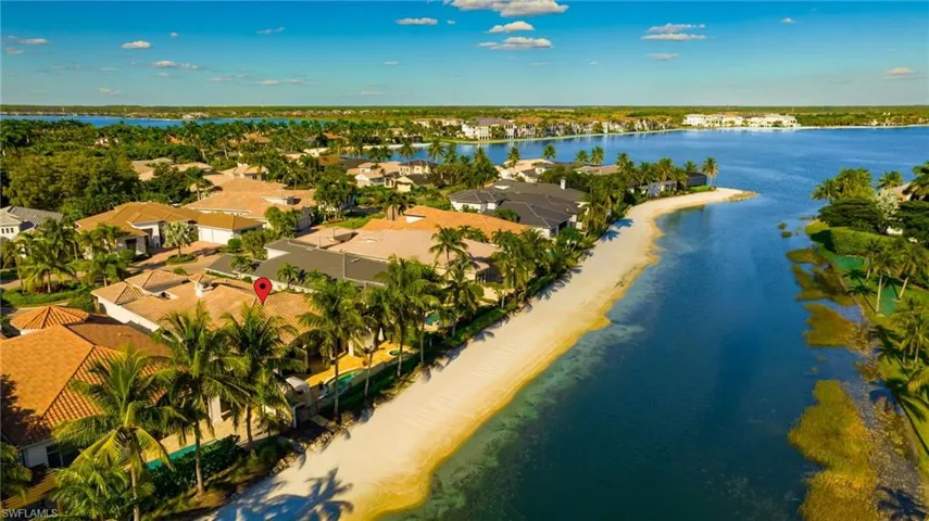 Aerial view of residential area featuring extended coastline