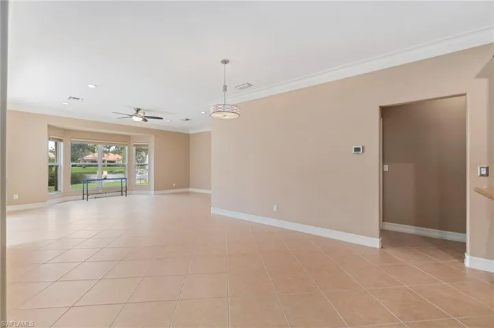 Spare room with ornamental molding, light tile patterned floors, ceiling fan, and recessed lighting