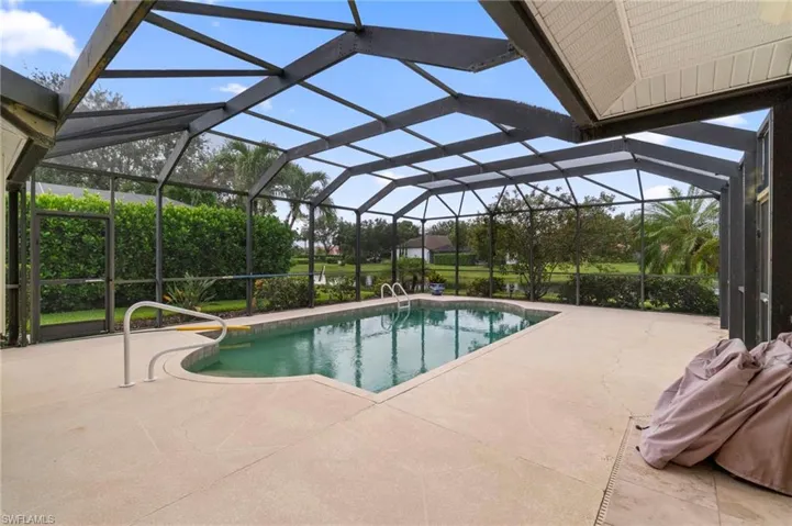 Outdoor pool with a patio area and a lanai
