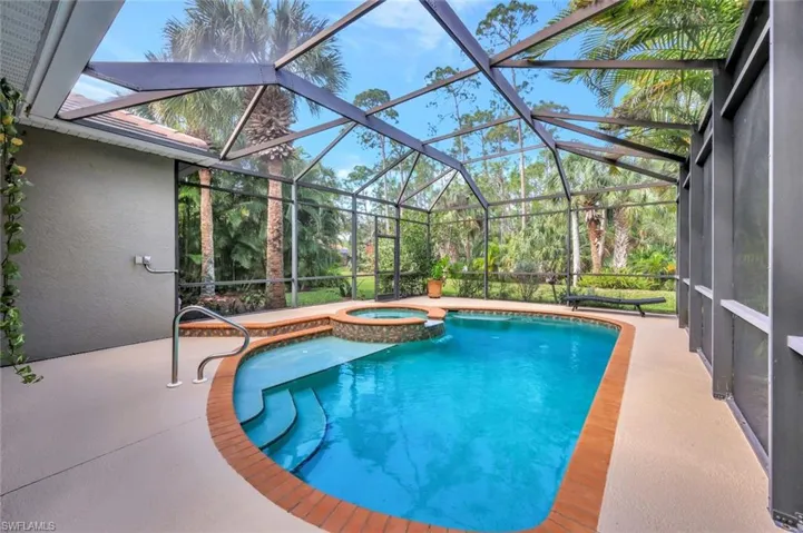 Spacious back lanai with pool & spa with private preserve setting