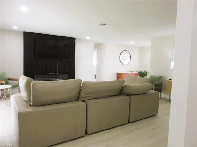 Living room with light hardwood / wood-style flooring