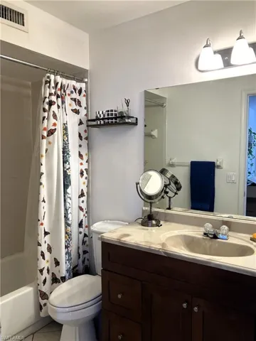 Upstairs primary bathroom with tub/shower combo