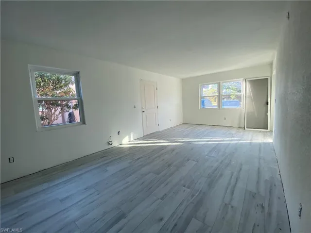 Empty room featuring wood finished floors