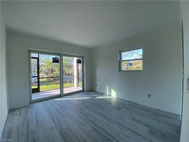 Empty room featuring wood finished floors
