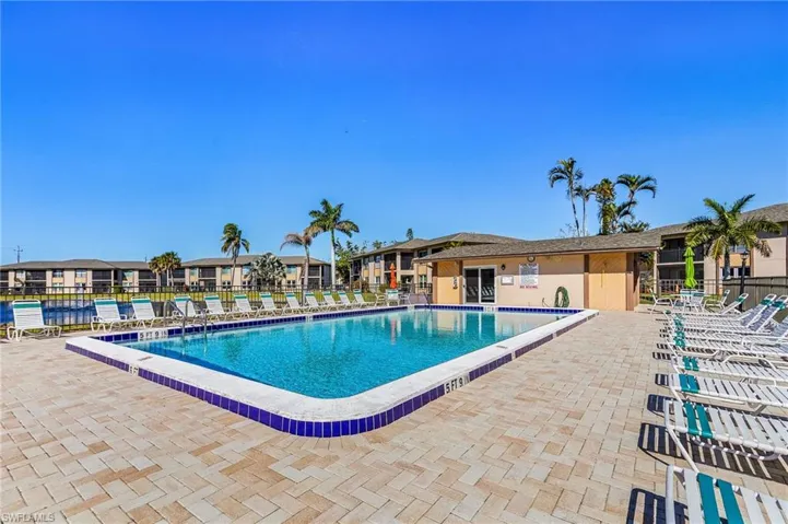 Community pool with a patio area