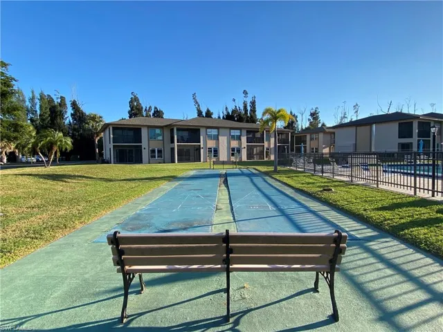View of community featuring shuffleboard