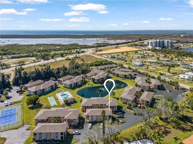 Aerial view of residential area featuring a large body of water