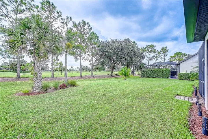 View of yard with a lanai