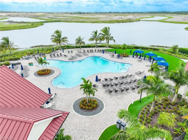 View of swimming pool featuring a water view and a patio area