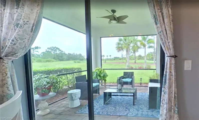 Sunroom featuring ceiling fan