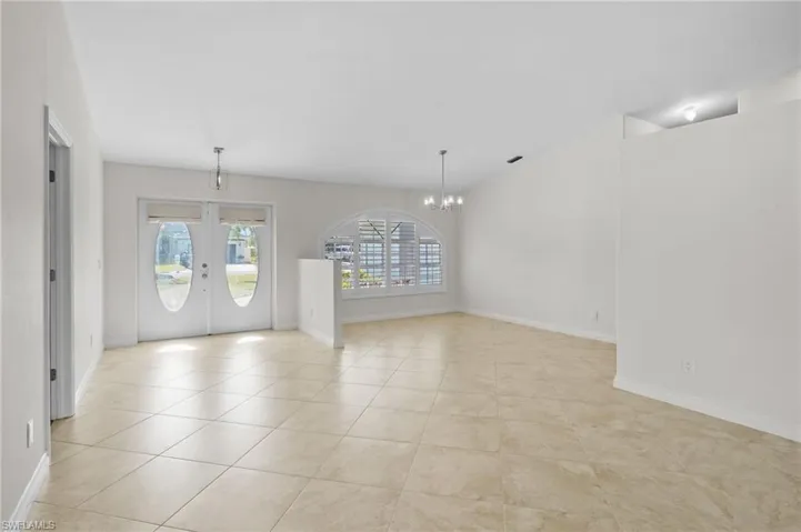 Empty room with wood finished floors and ceiling fan