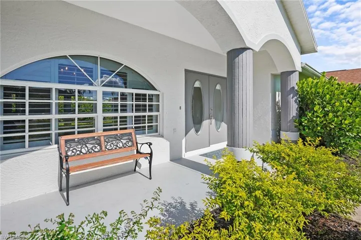 View of exterior entry featuring stucco siding