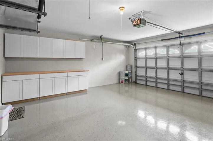 Garage featuring a garage door opener