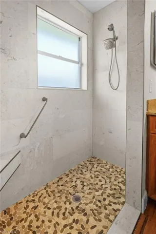 Full bathroom with tiled shower