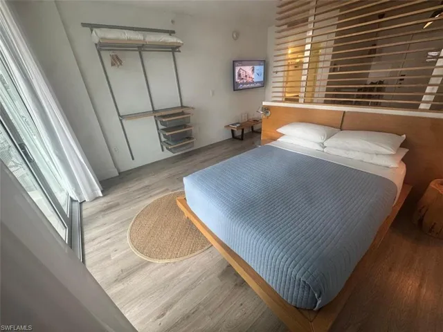 Bedroom with light hardwood / wood-style floors