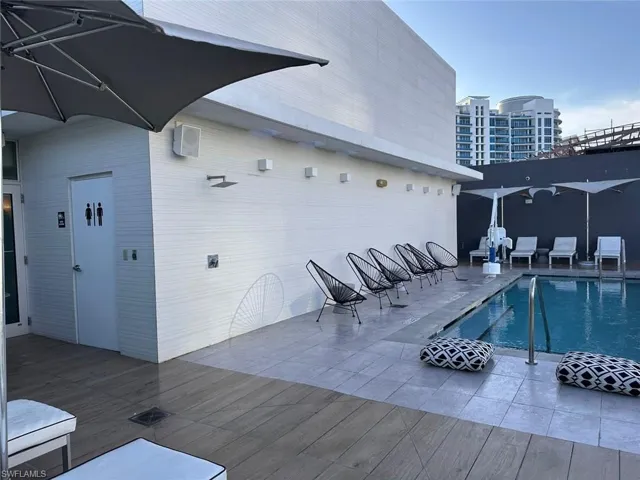 View of pool with a wooden deck